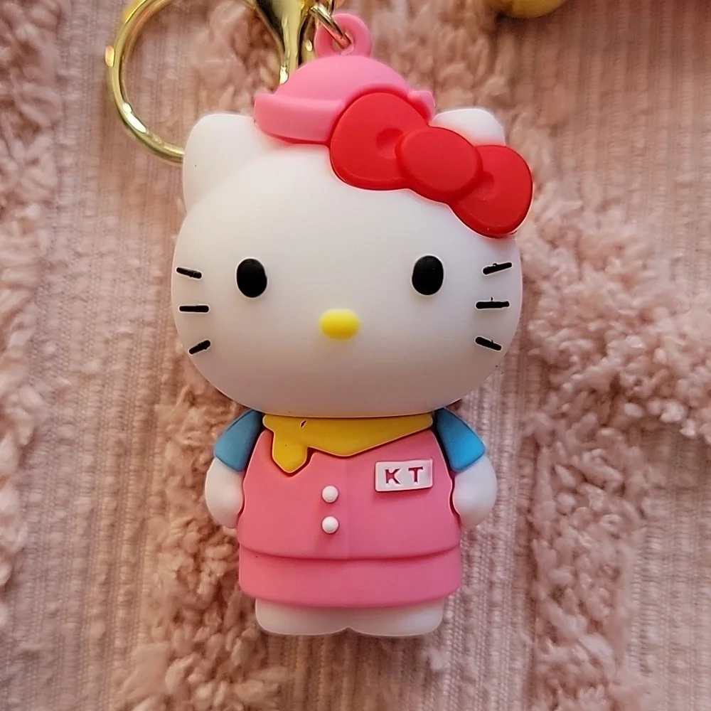 Hello Kitty, silicon keychain. NWOT. Metal hooks, pink and white 💗.
